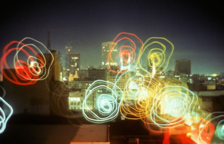 Melbourne skyline at night with blurred squiggles